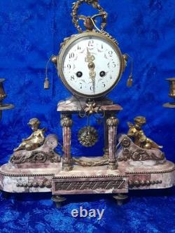 Antique bronze clock with cherub decorations, late 19th to early 20th century, Louis XVI style