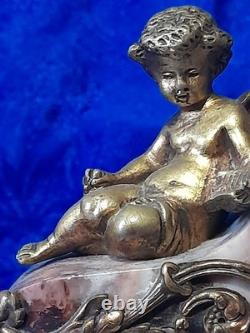 Antique bronze clock with cherub decorations, late 19th to early 20th century, Louis XVI style