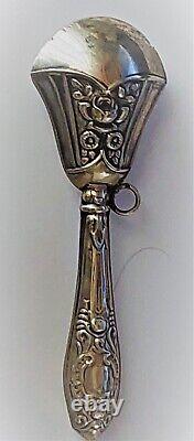 Antique silver rattle with pink decoration from the late 19th century