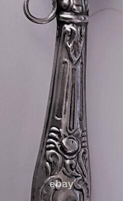 Antique silver rattle with rose decoration, late 19th century