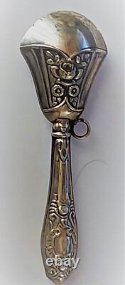 Antique silver rattle with rose decoration, late 19th century