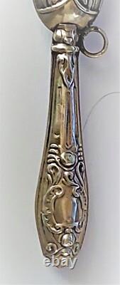 Antique silver rattle with rose decoration, late 19th century