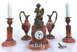Bronze mantel clock with cherub, cassolette candle holders, Louis XVI style, 19th century period