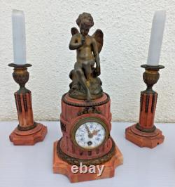 Bronze mantel clock with cherub, cassolette candle holders, Louis XVI style, 19th century period