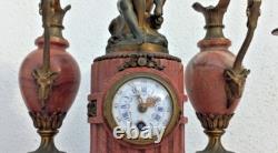 Bronze mantel clock with cherub, cassolette candle holders, Louis XVI style, 19th century period