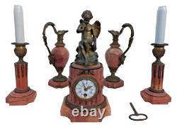 Bronze mantel clock with cherub, cassolette candle holders, Louis XVI style, 19th century period