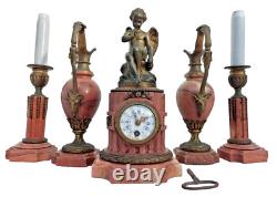 Bronze mantel clock with cherub, cassolette candle holders, Louis XVI style, 19th century period