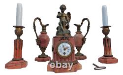 Bronze mantel clock with cherub, cassolette candleholders, Louis XVI style, 19th century period