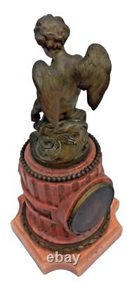 Bronze mantel clock with cherub, cassolette candleholders, Louis XVI style, 19th century period