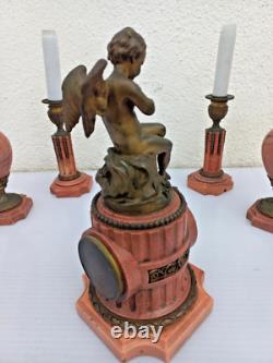 Bronze mantel clock with cherub, cassolette candleholders, Louis XVI style, 19th century period