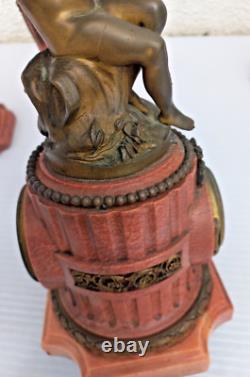 Bronze mantel clock with cherub, cassolette candleholders, Louis XVI style, 19th century period