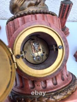 Bronze mantel clock with cherub, cassolette candleholders, Louis XVI style, 19th century period
