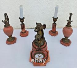 Bronze mantel clock with cherub, cassolette candleholders, Louis XVI style, 19th century period