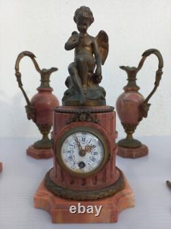 Bronze mantel clock with cherub, cassolette candleholders, Louis XVI style, 19th century period