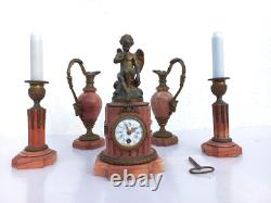Bronze mantel clock with cherub, cassolette candleholders, Louis XVI style, 19th century period