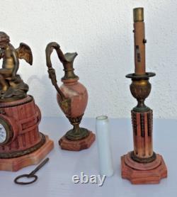 Bronze mantel clock with cherub, cassolette candleholders, Louis XVI style, 19th century period