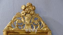 Carved and Gilded Wooden Empire Mirror with Pediment from the Early 19th Century