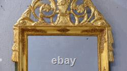 Carved and Gilded Wooden Empire Mirror with Pediment from the Early 19th Century