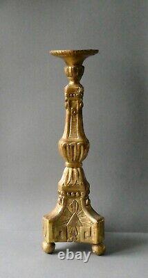 Carved and gilded wooden candlestick, 19th century