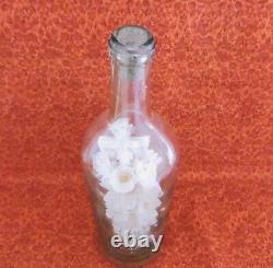 Ceremonial Bouquet In A Large 19th Century Blown Glass Bottle