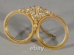 Double photo frame in gilded brass, late 19th century