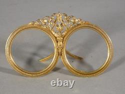 Double photo frame in gilded brass, late 19th century