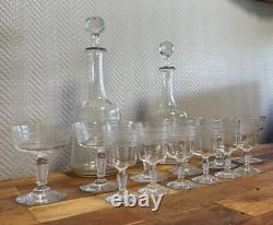 Engraved crystal service comprising 12 glasses and 2 decanters, late 19th century