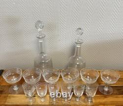 Engraved crystal service comprising 12 glasses and 2 decanters, late 19th century