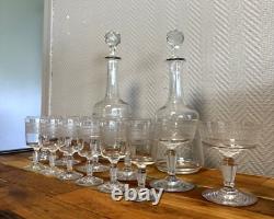 Engraved crystal service comprising 12 glasses and 2 decanters, late 19th century