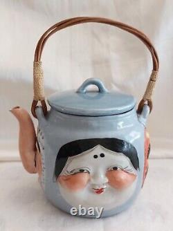 Japanese Porcelain Teapot from the Meiji Period, Late 19th to Early 20th Century, Decorated with Masks