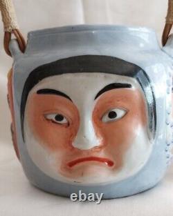 Japanese Porcelain Teapot from the Meiji Period, Late 19th to Early 20th Century, Decorated with Masks