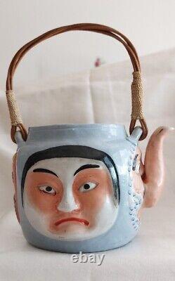 Japanese Porcelain Teapot from the Meiji Period, Late 19th to Early 20th Century, Decorated with Masks