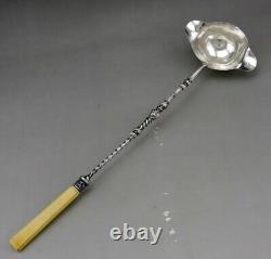 Ladle for punch or cream in solid silver and bone, 19th century