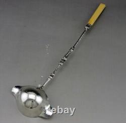 Ladle for punch or cream in solid silver and bone, 19th century