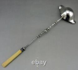 Ladle for punch or cream in solid silver and bone, 19th century