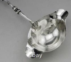 Ladle for punch or cream in solid silver and bone, 19th century