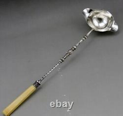 Ladle for punch or cream in solid silver and bone, 19th century