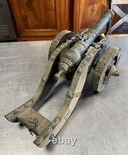 Large model of a cast iron cannon, wood and repoussé metal, late 19th century