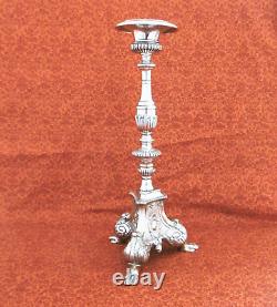 Large silver-plated candle holder, stamped from the 19th century. H. 37.5 cm