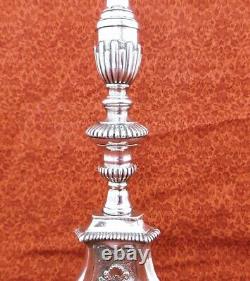Large silver-plated candle holder, stamped from the 19th century. H. 37.5 cm