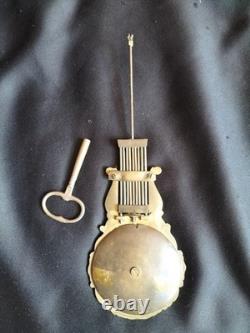 Light wood and gilded bronze pendulum clock / Restoration period / 19th century