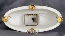 Louis XVI period clock, in white biscuit porcelain, signed Romilly