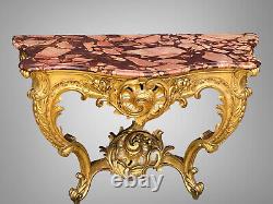 Nineteenth-century gilded and carved wooden console table with a veined red marble top