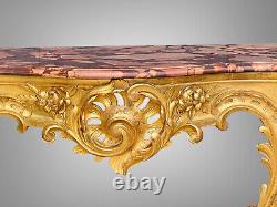 Nineteenth-century gilded and carved wooden console table with a veined red marble top