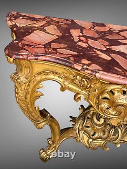 Nineteenth-century gilded and carved wooden console table with a veined red marble top