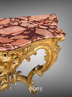 Nineteenth-century gilded and carved wooden console table with a veined red marble top