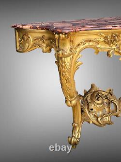 Nineteenth-century gilded and carved wooden console table with a veined red marble top