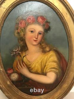 Oil painting on panel of a young woman with flowers, 19th century.