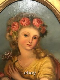 Oil painting on panel of a young woman with flowers, 19th century.
