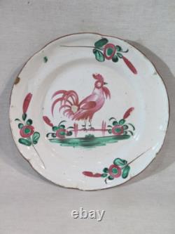 Old East French faience plate, polychrome decoration with rooster and flowers, 19th century
